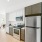 Kitchen with stainless steel appliances and white cabinets